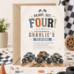 Ready set four monster truck birthday invitation with blue, orange, and green monster trucks on a dirt track with checkered flags in blue, orange, and green